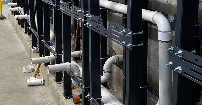 Everflow logo over PVC piping installed in a commercial plumbing system.