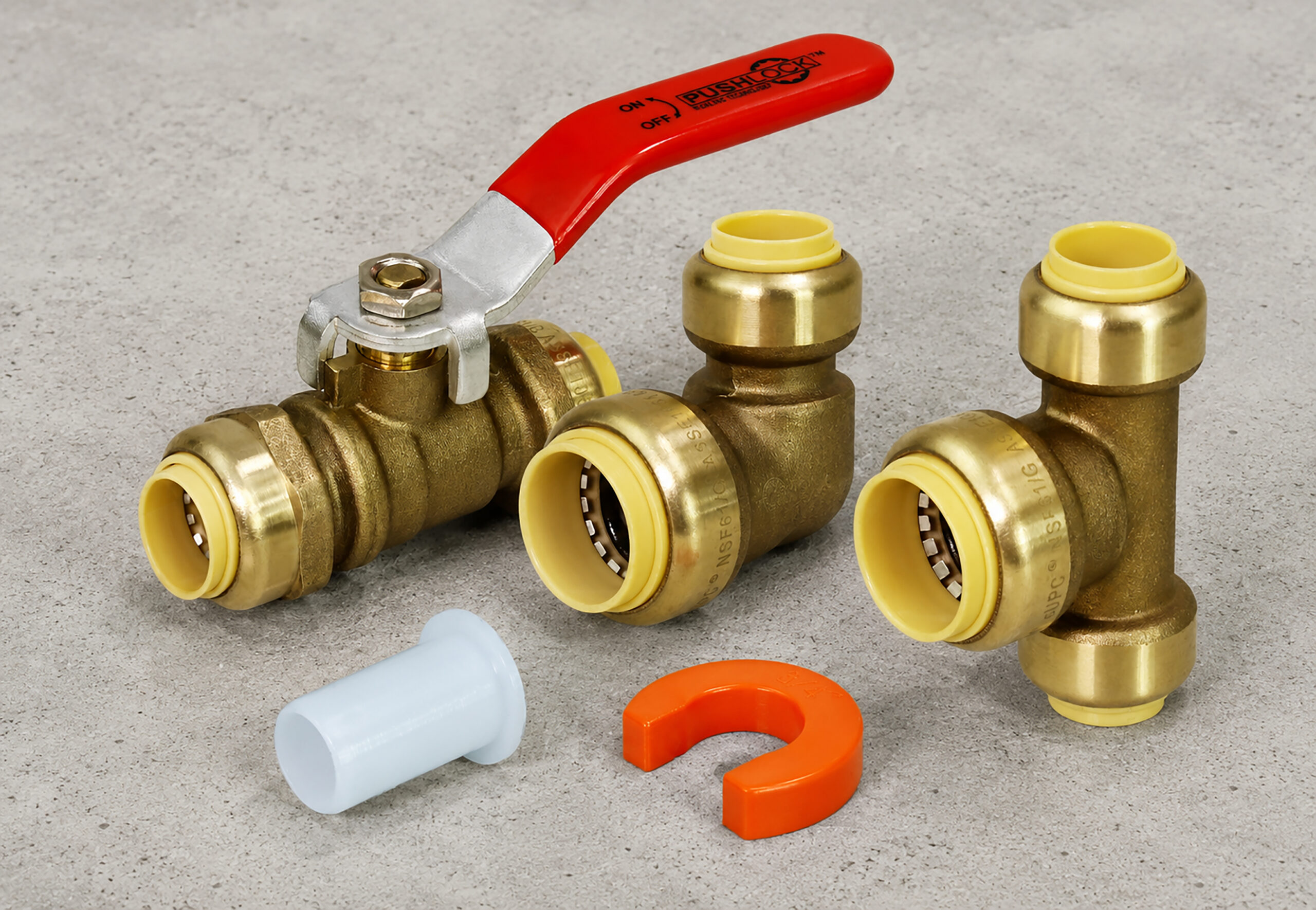 PushLock brass push-fit ball valve and tee fittings with removal tools.
