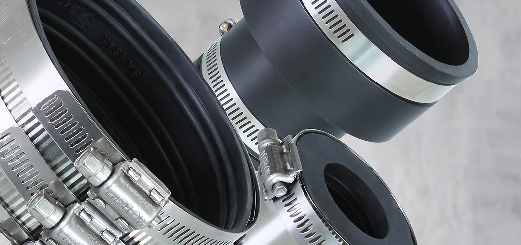 Flexible plumbing couplings and stainless steel gear hose clamps.