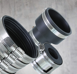 Flexible pipe couplings with stainless steel bands for secure plumbing connections.