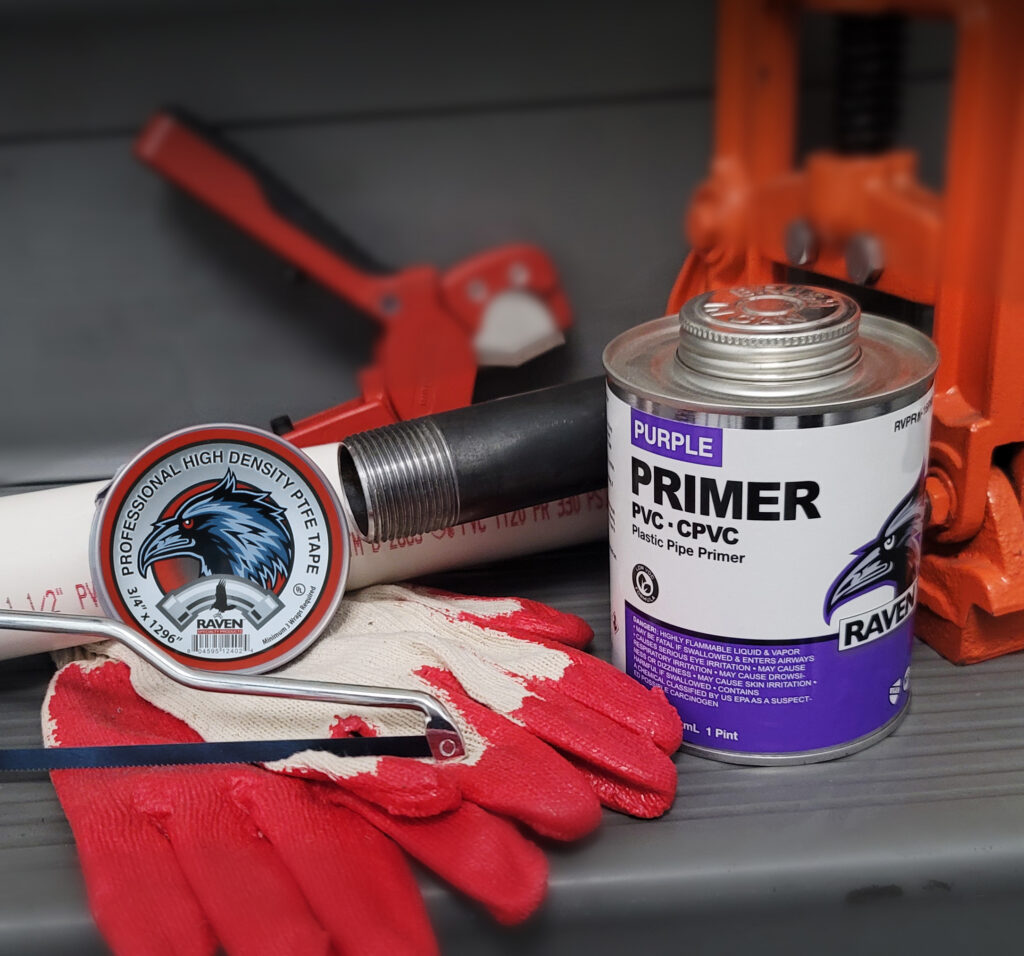 Raven purple PVC and CPVC primer with pipe and professional plumbing tools.