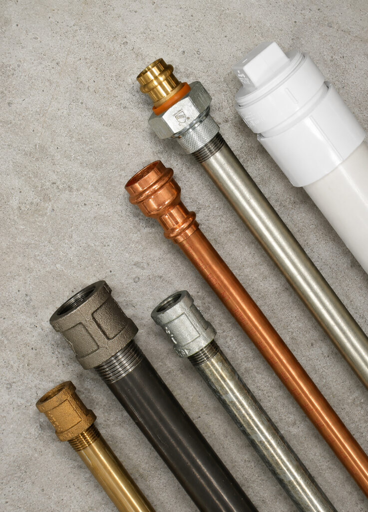 A variety of Everflow fittings and nipples in various sizes and types.
